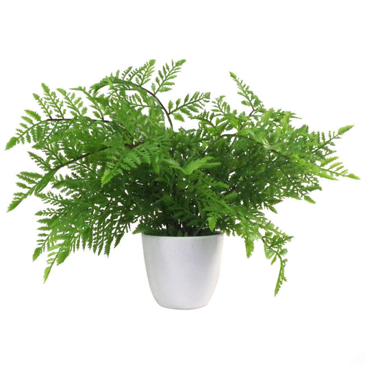 An artificial fern plant with green fronds in a white plastic pot.