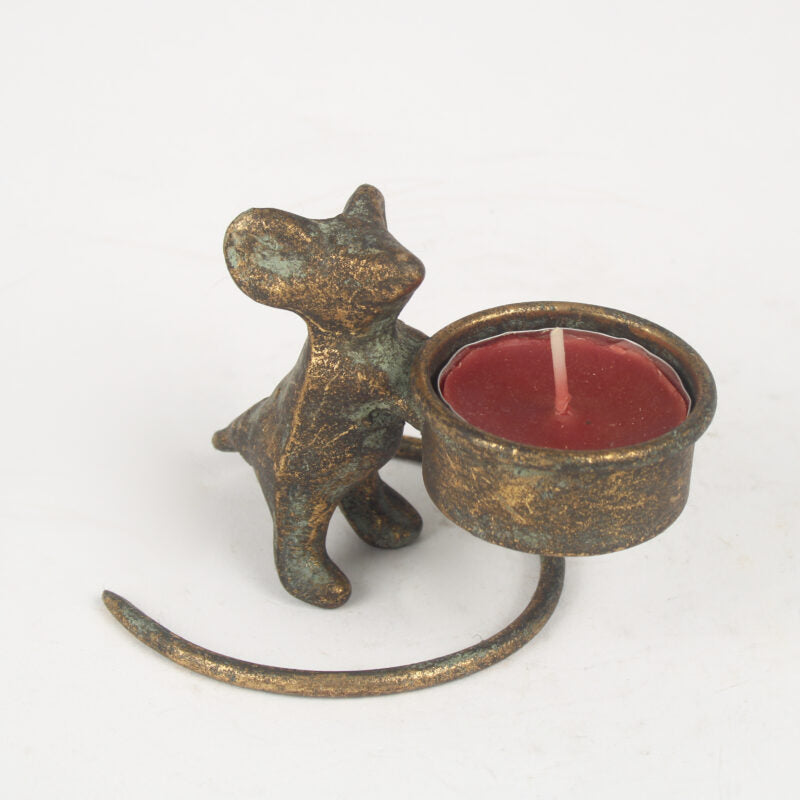 A small decorative metal candle holder shaped like a mouse holding a round tealight candle, shown on a plain white background.