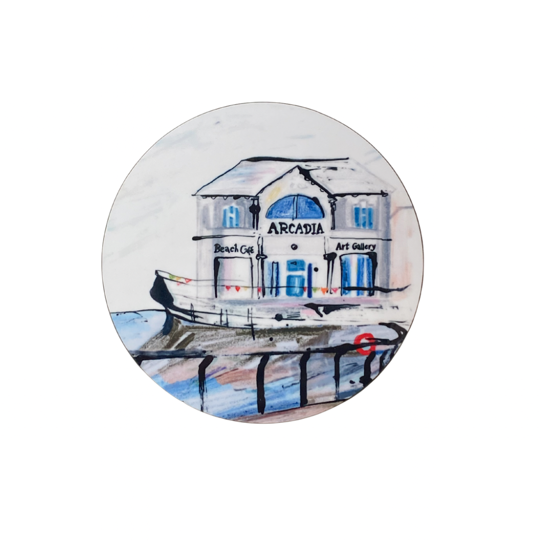 Round coaster with a painting of a building labeled 'Arcadia' on a white background