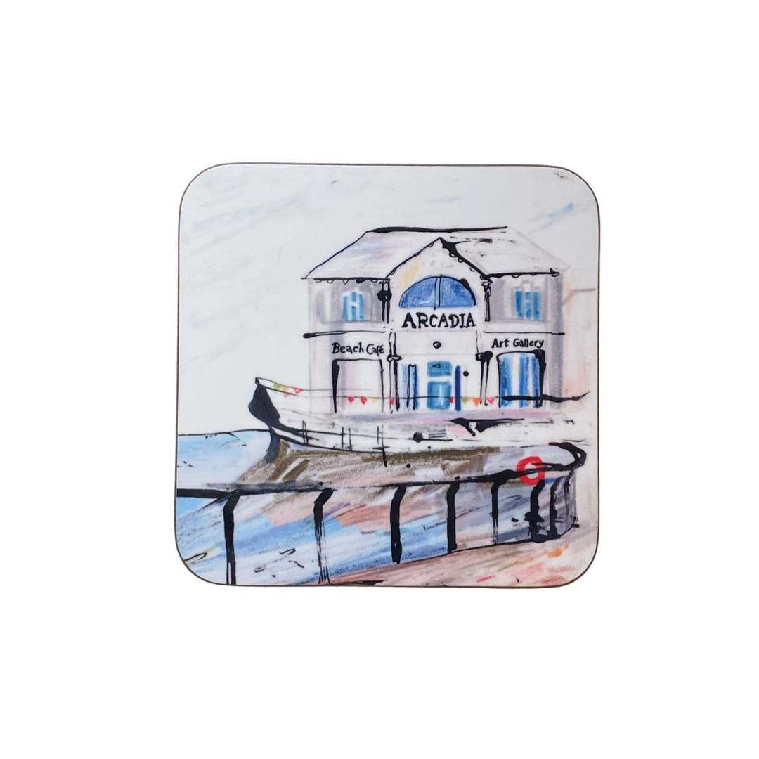 Coaster with a design of a building labeled 'Arcadia Beach Cafe & Art Gallery' on a white background