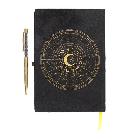 Black velvet Astrology Wheel notebook with matching black obsidian pen on a white background
