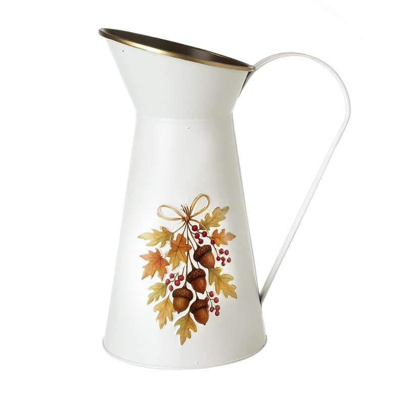 White pitcher with autumn leaf and acorn design on a white background