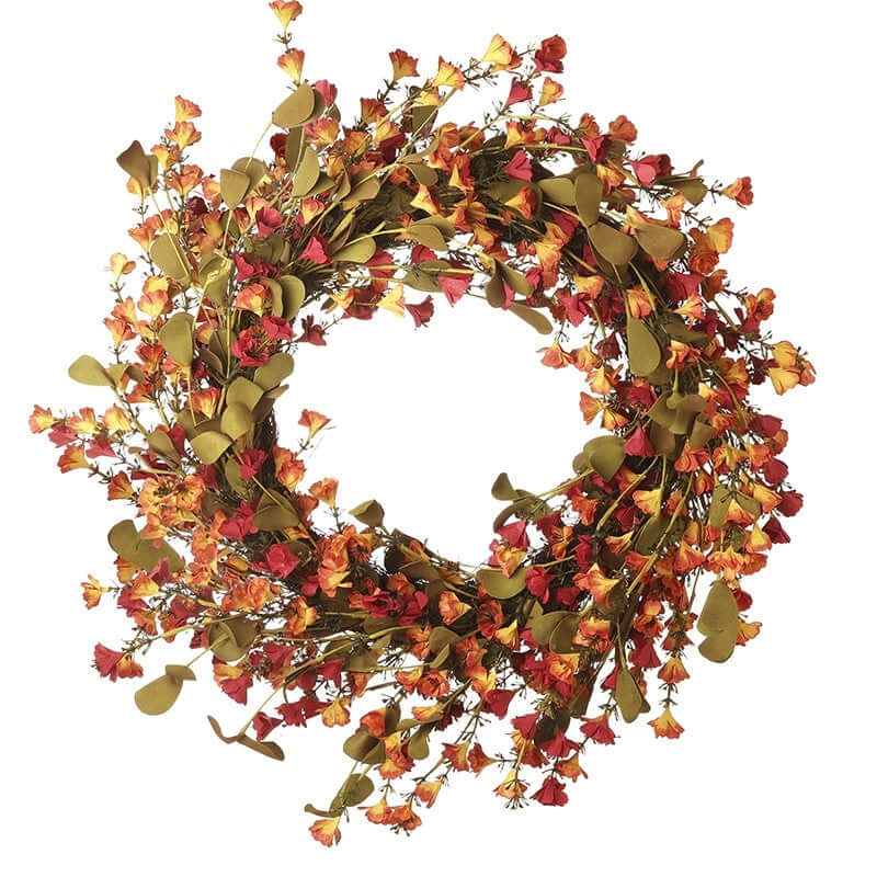 Decorative wreath with autumnal leaves and flowers on a white background