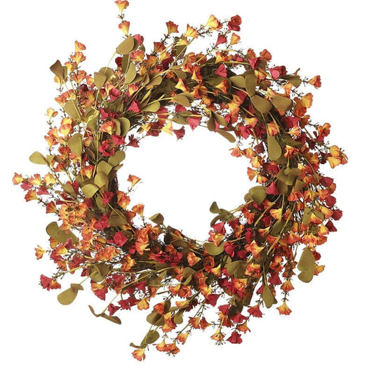 Decorative wreath with autumnal leaves and flowers on a white background