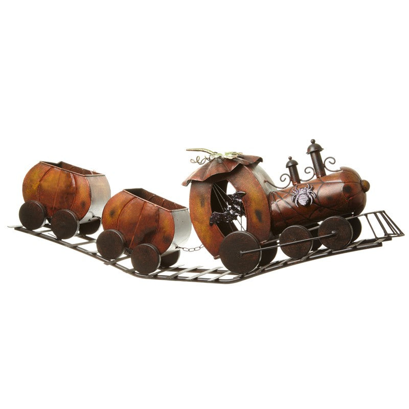 Metal train model with three carriages on a white background