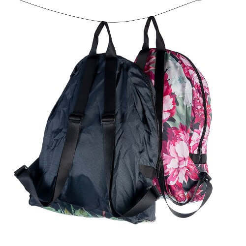 Black drawstring bag and floral backpack on a white background