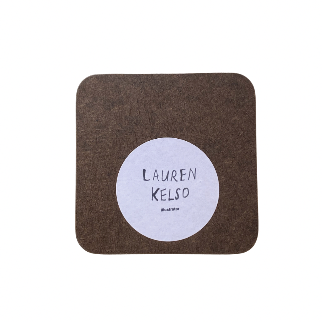 Brown square coaster with a white circular label featuring 'Lauren Kelso' on a white background