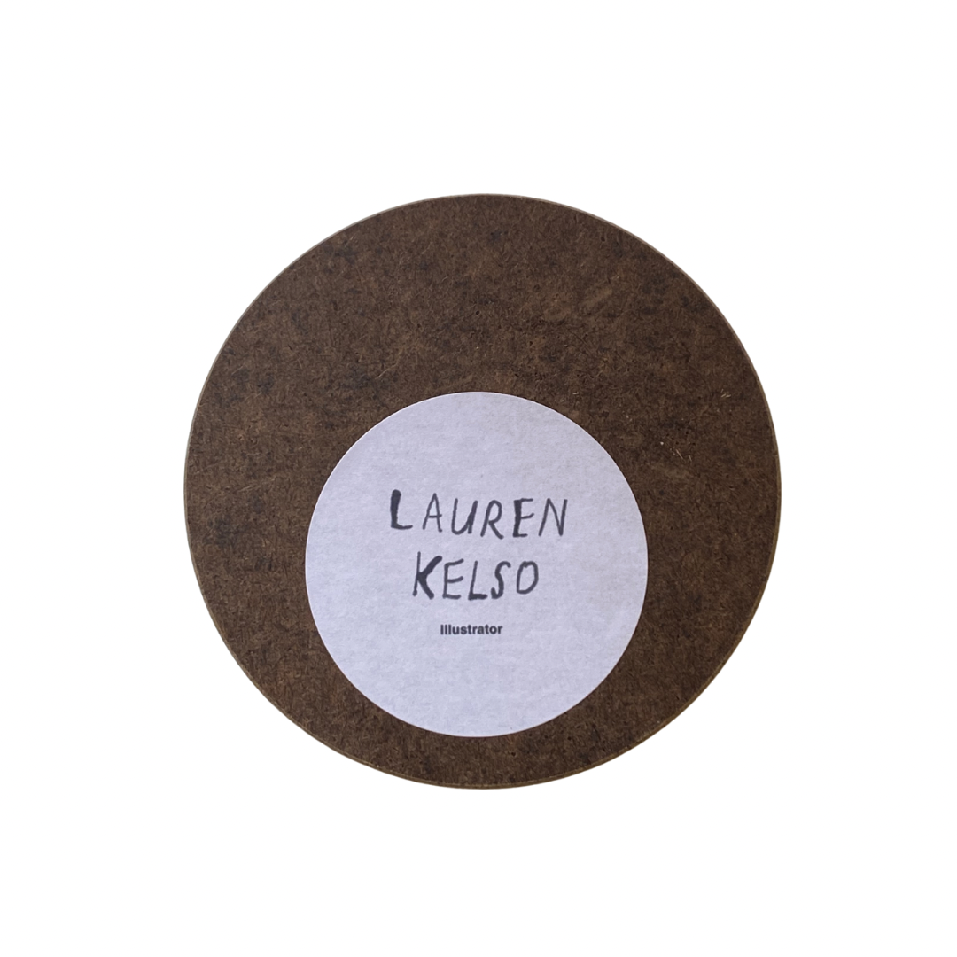 Round brown coaster with a white center displaying 'Lauren Kelso' on a white background