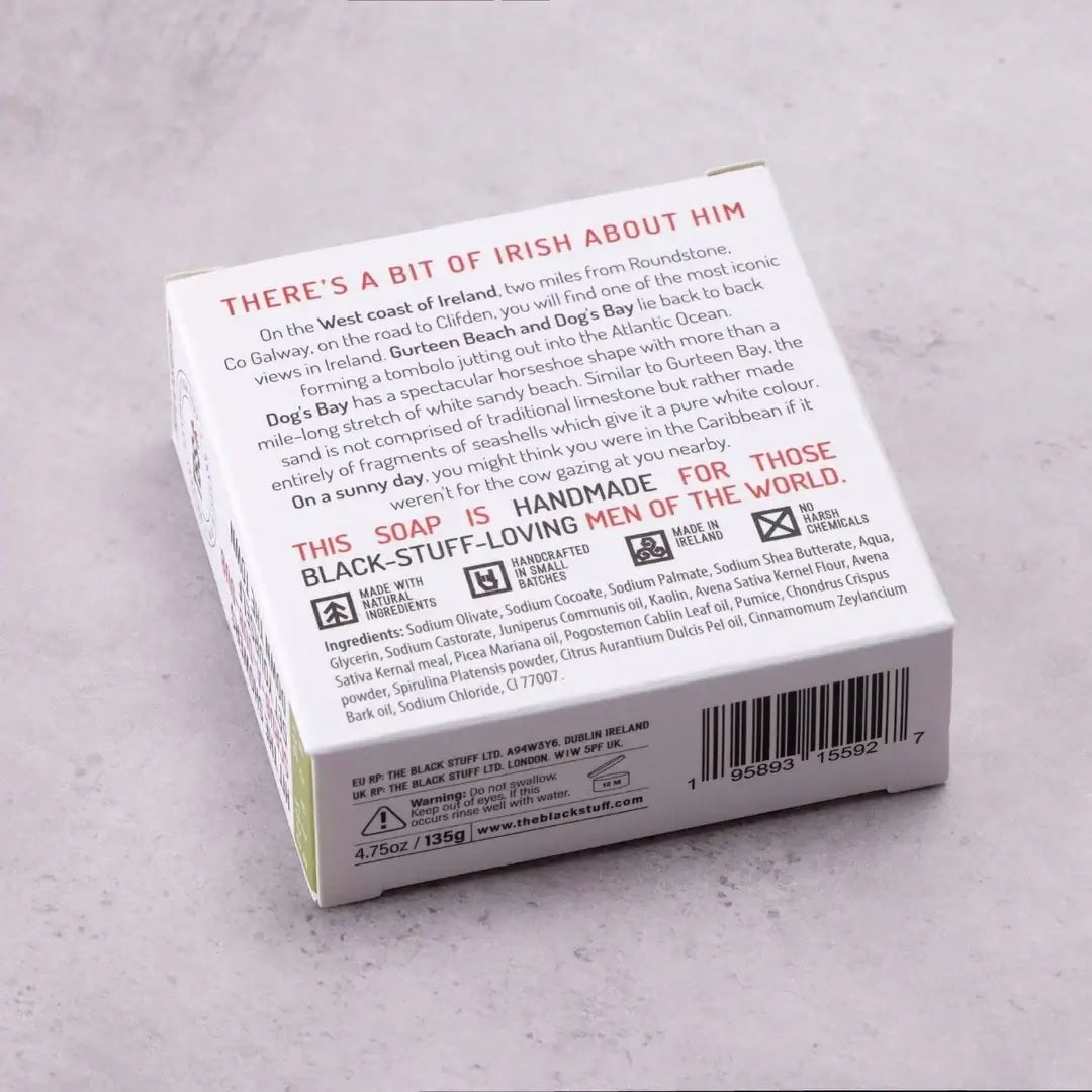Packaging for 'The Black Stuff' Dogs Bay Beach bar soap, featuring the product name, a small amount of soap, and a rough feel description.