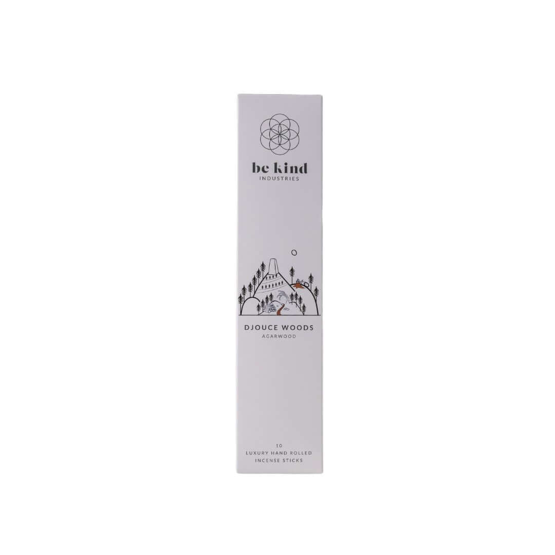 A package of Be Kind brand incense sticks labeled 'Djouce Woods' with a graphic design featuring trees and a cabin in the woods.