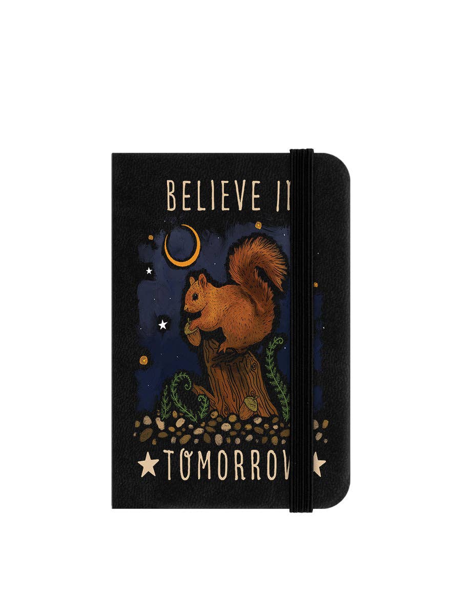 Notebook with a squirrel illustration and motivational text on a white background