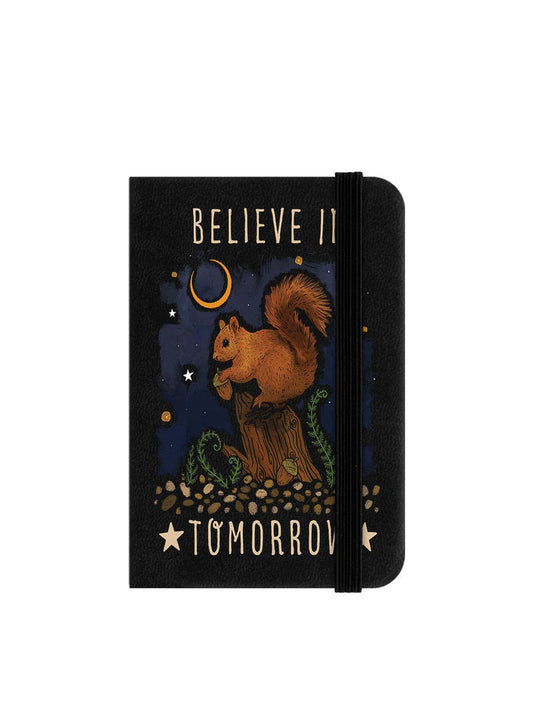 Notebook with a squirrel illustration and motivational text on a white background
