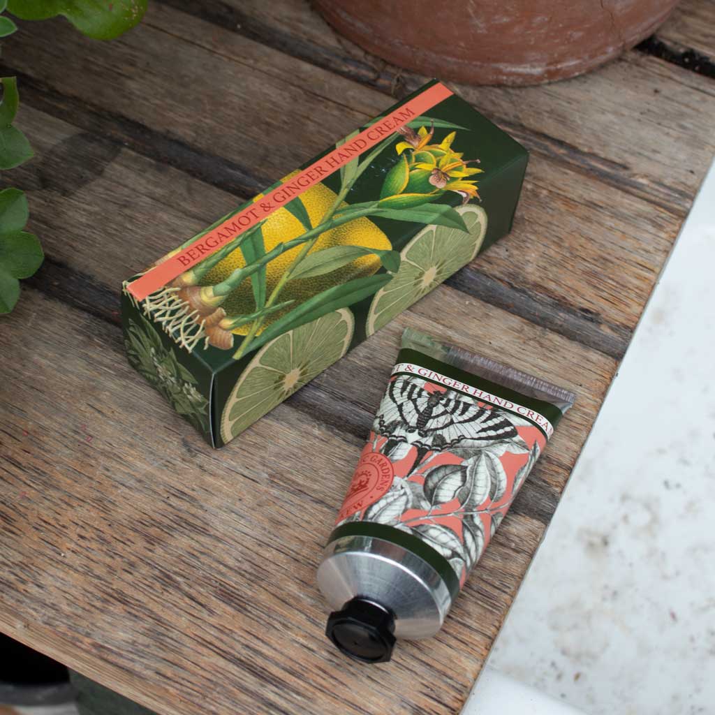 Hand cream with decorative packaging on a wooden surface