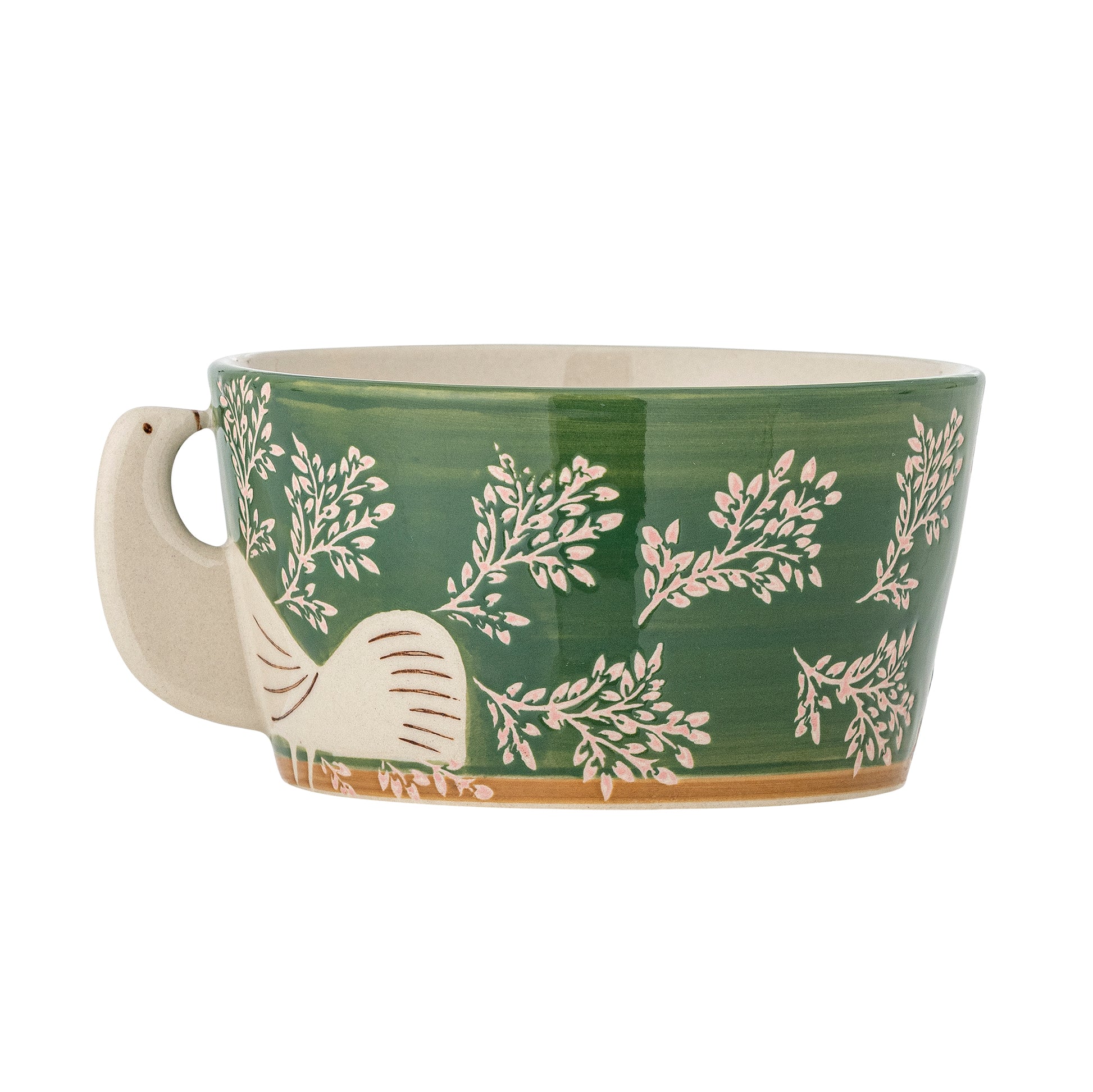 Green ceramic mug with white leaf pattern and elephant design on a white background