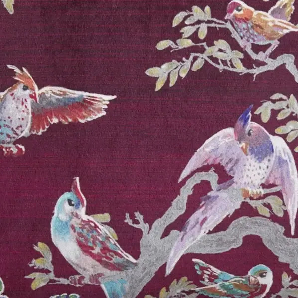 Close-up of the bird and blossom print on the pink Birdity Absurdity cushion