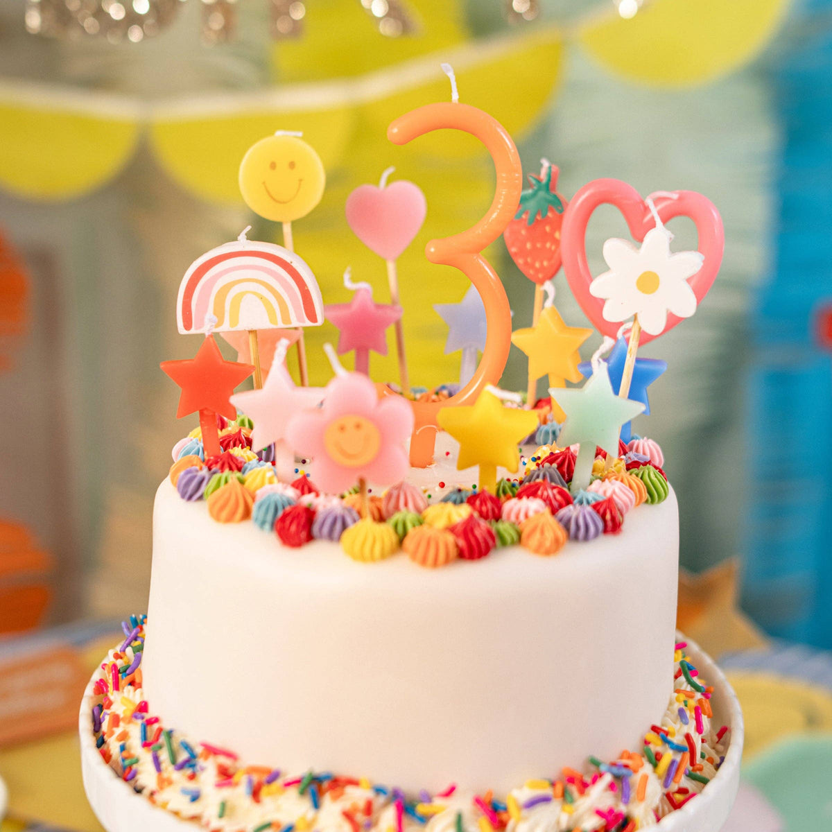 Birthday candles on a colourful cake