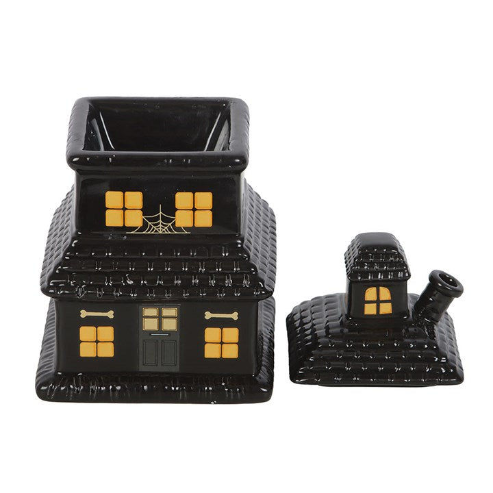Black Halloween-themed wax warmer house with yellow details on a white background