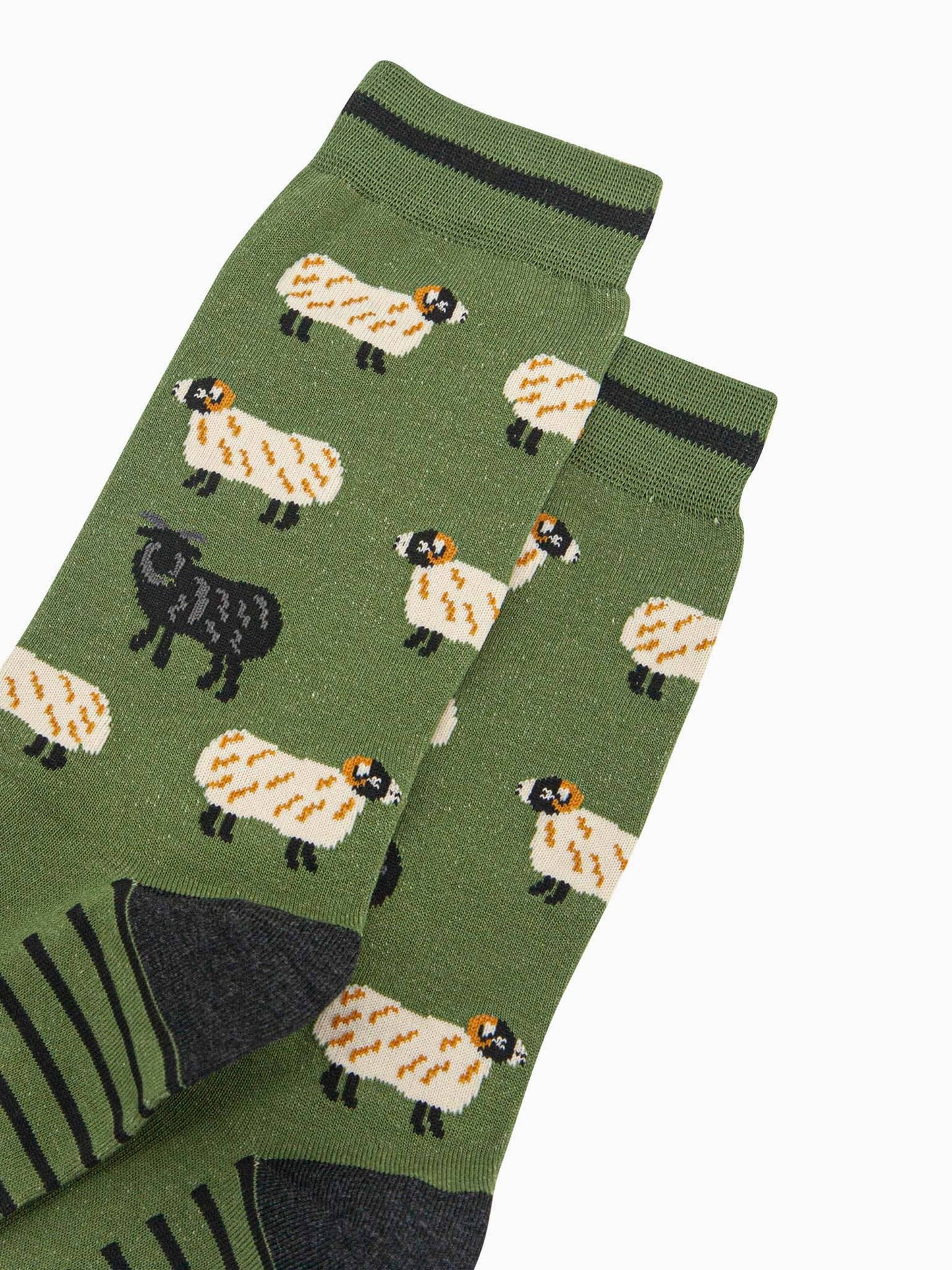 Green socks with sheep pattern on a white background
