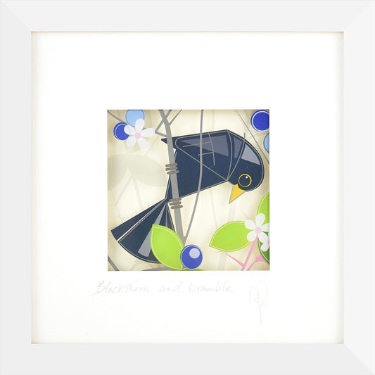 Framed artwork of a blue bird with floral elements on a white background