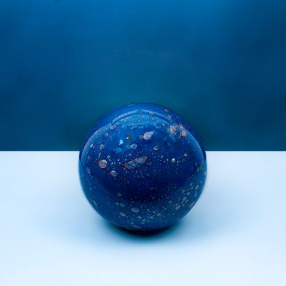 Blue round glass lamp object on a blue background