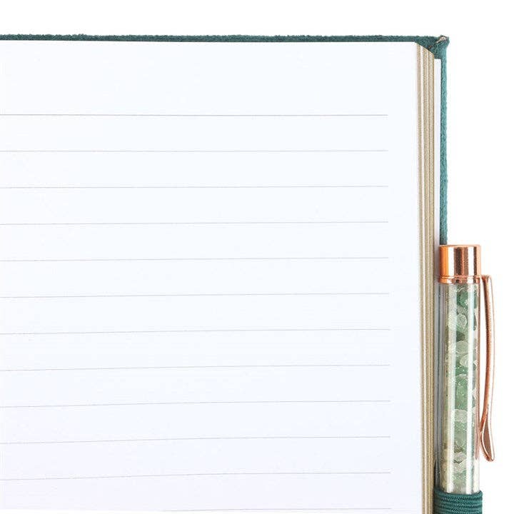 Notebook with a pen holder on the side, showing lined pages.