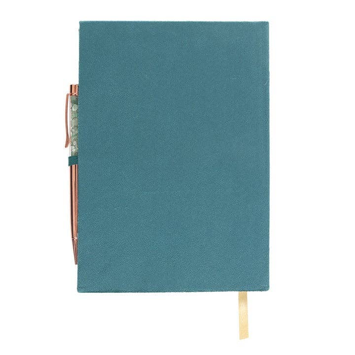 Teal notebook with a pen holder on a white background