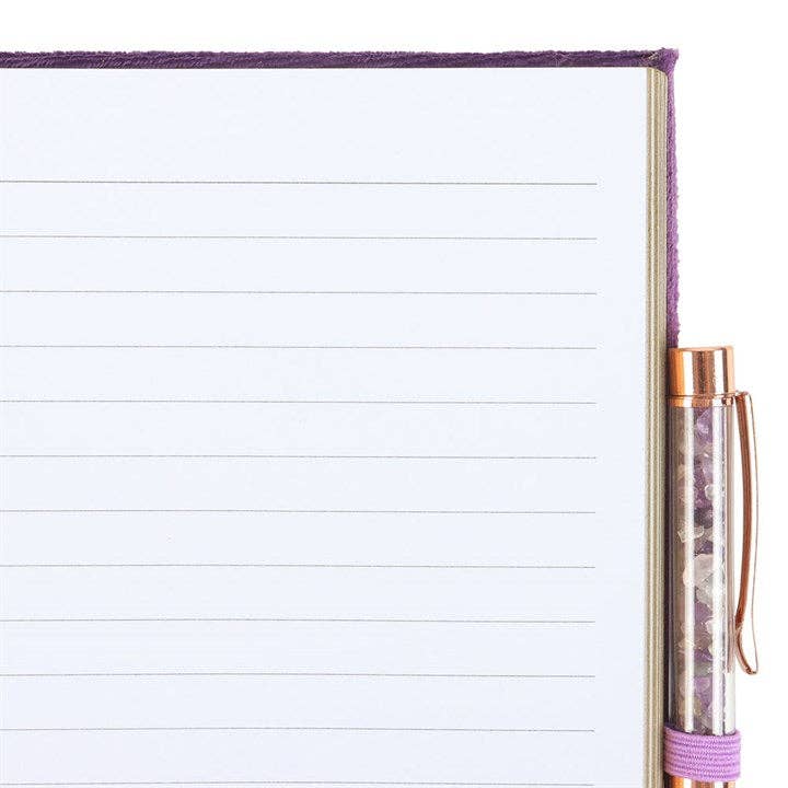 Notebook with a pen on a white background