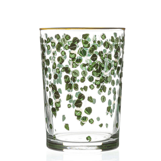 A cylindrical highball glass with a green botanical leaf pattern and a subtle gold trim at the top.