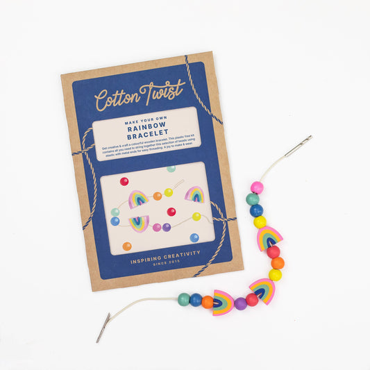 Rainbow beaded bracelet with packaging on a white background