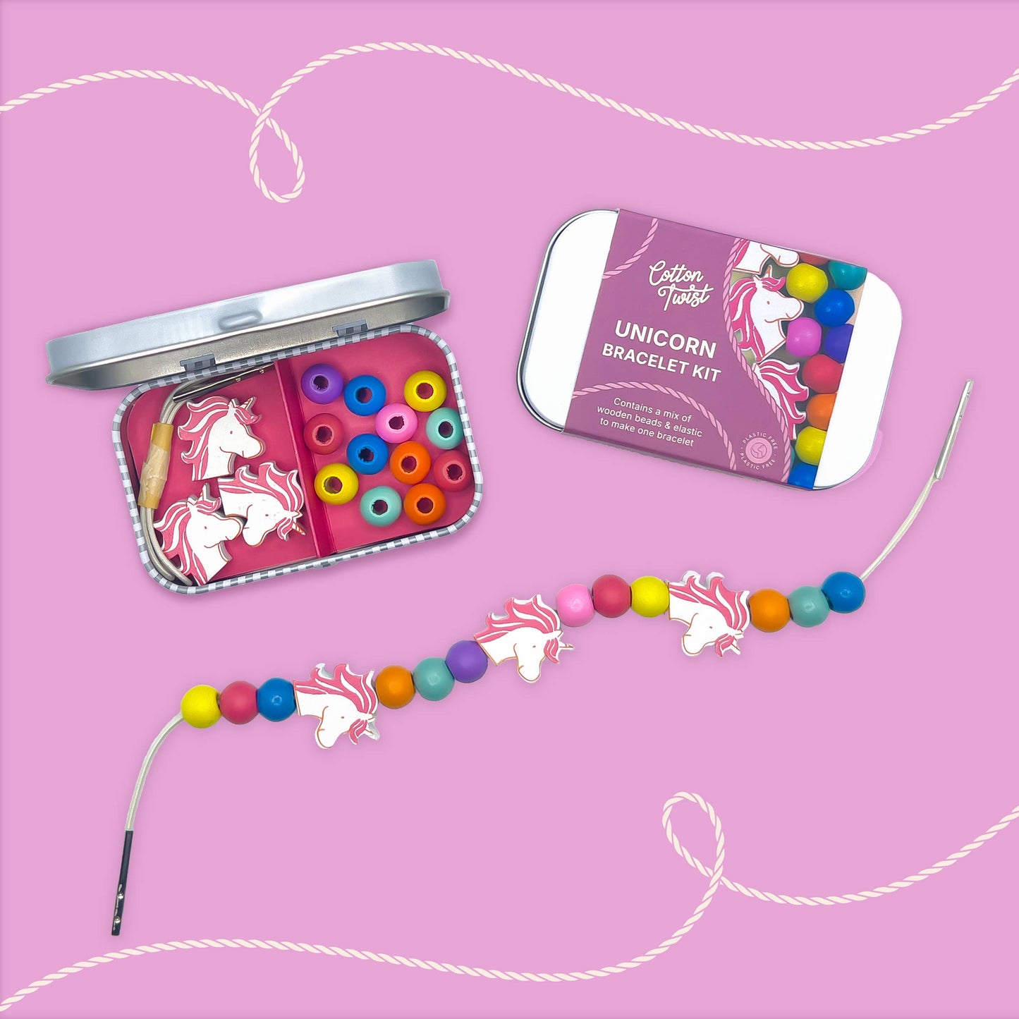 Unicorn bracelet kit with colorful beads and packaging on a pink background