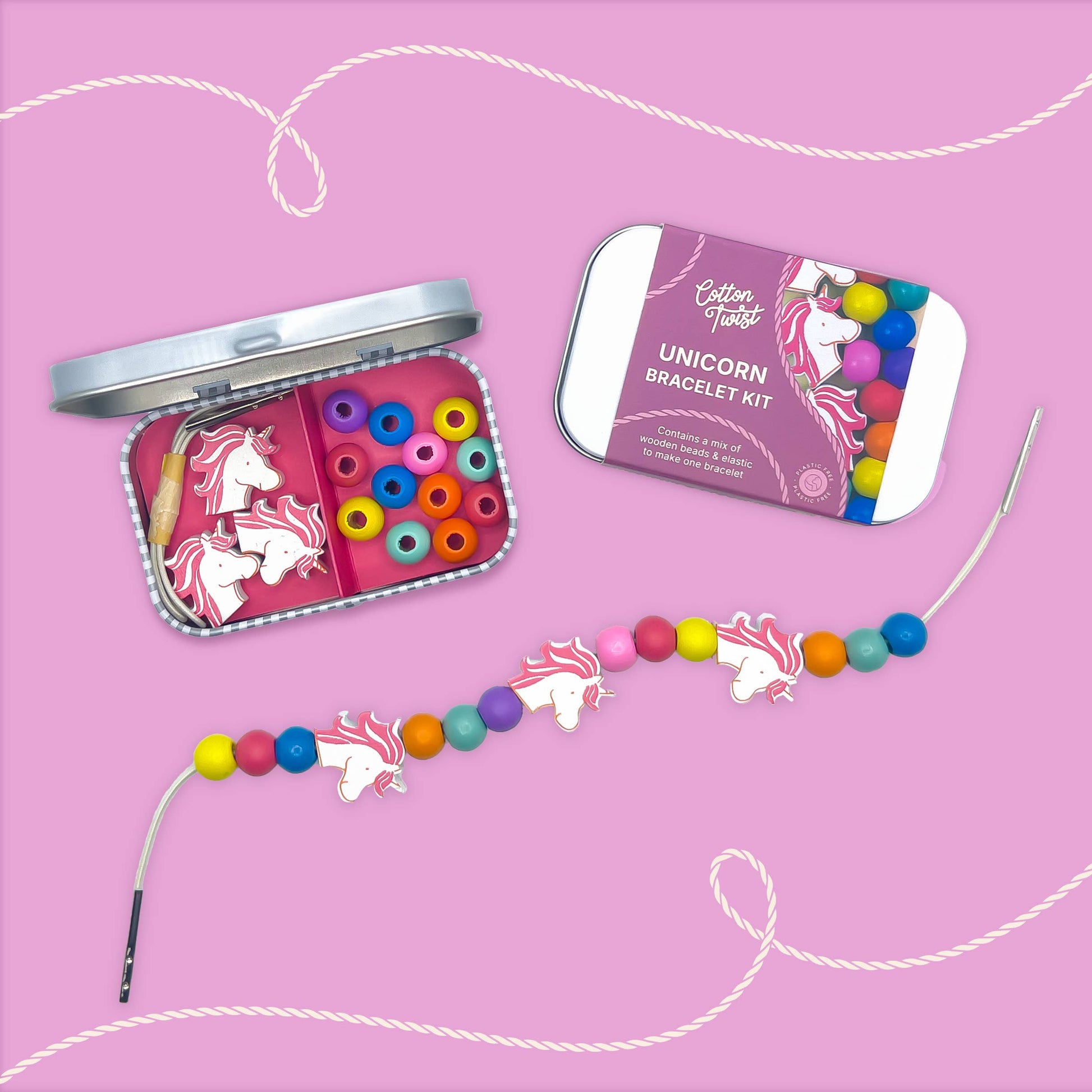 Unicorn bracelet kit with colorful beads and packaging on a pink background