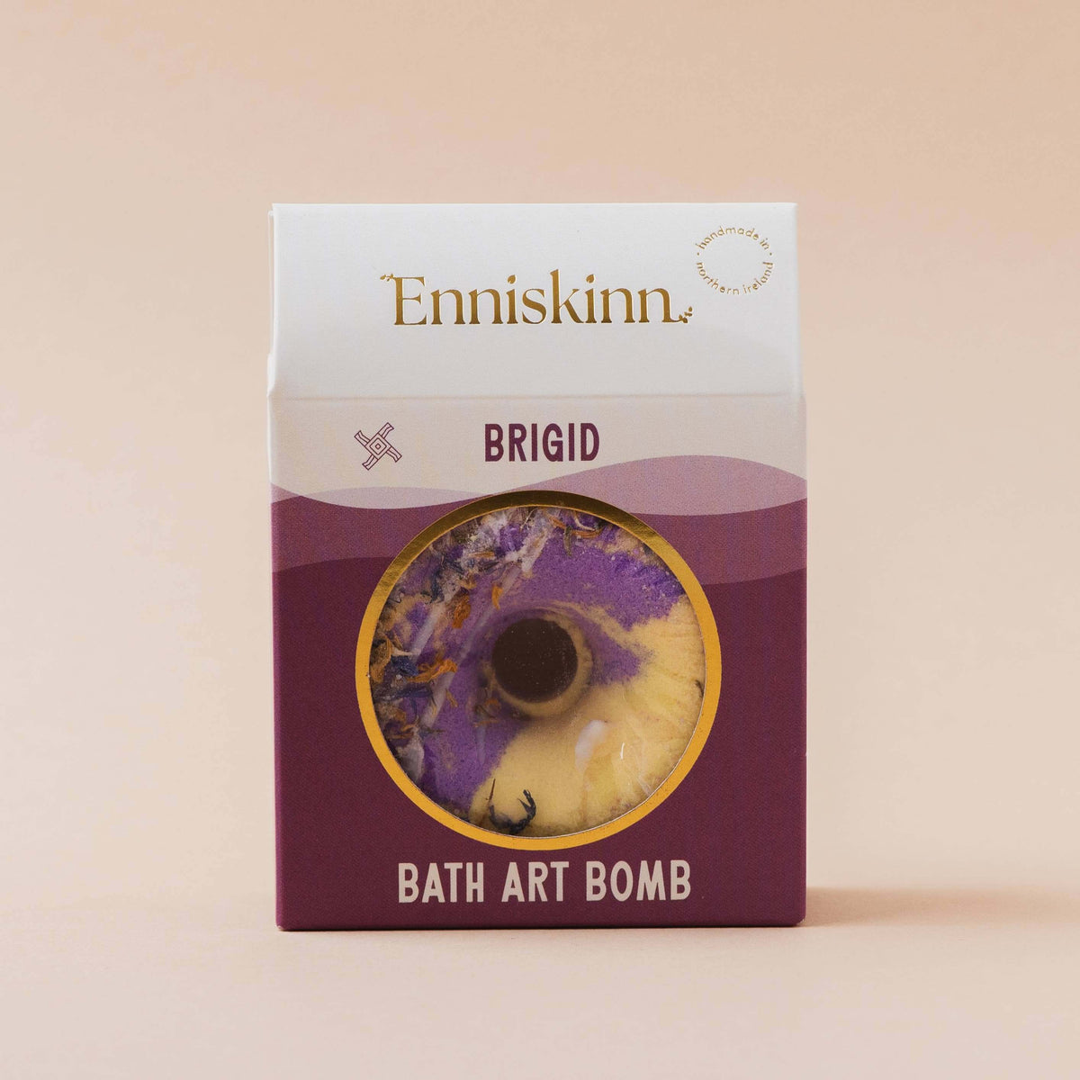 Enniskinn Brigid bath art bomb packaging on a beige background