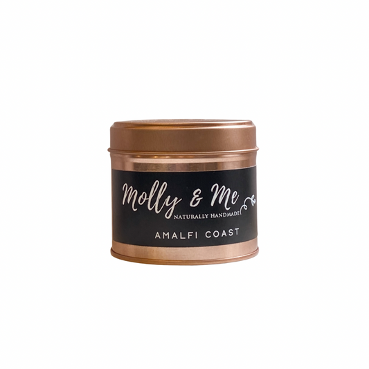 Candle tin with 'molly & me' branding on a white background