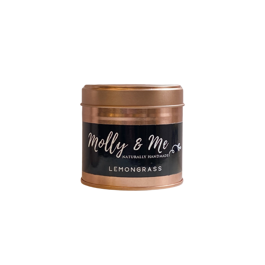 Copper-tinned candle labeled 'Molly & Me' with 'Lemongrass' on a white background