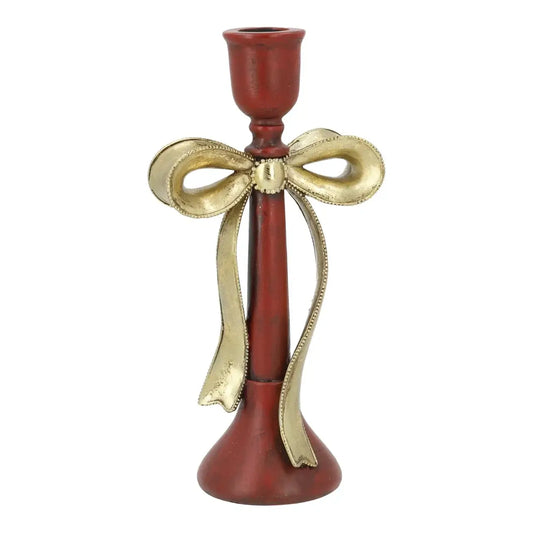 Decorative candle holder with a gold bow on a white background