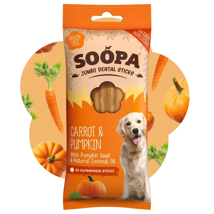 A package of Soopa Jumbo Dental Sticks for dogs, specifically the Carrot & Pumpkin flavor. The packaging is orange and beige with illustrations of carrots, pumpkins, and a golden retriever dog.
