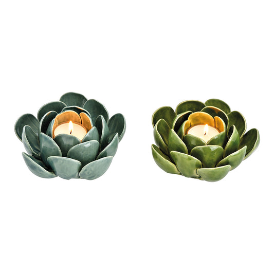 Two ceramic artichoke-shaped candle holders on a white background