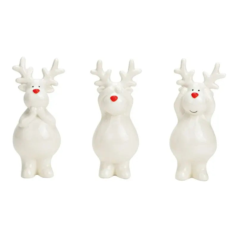 Three white reindeer figurines with red noses on a white background