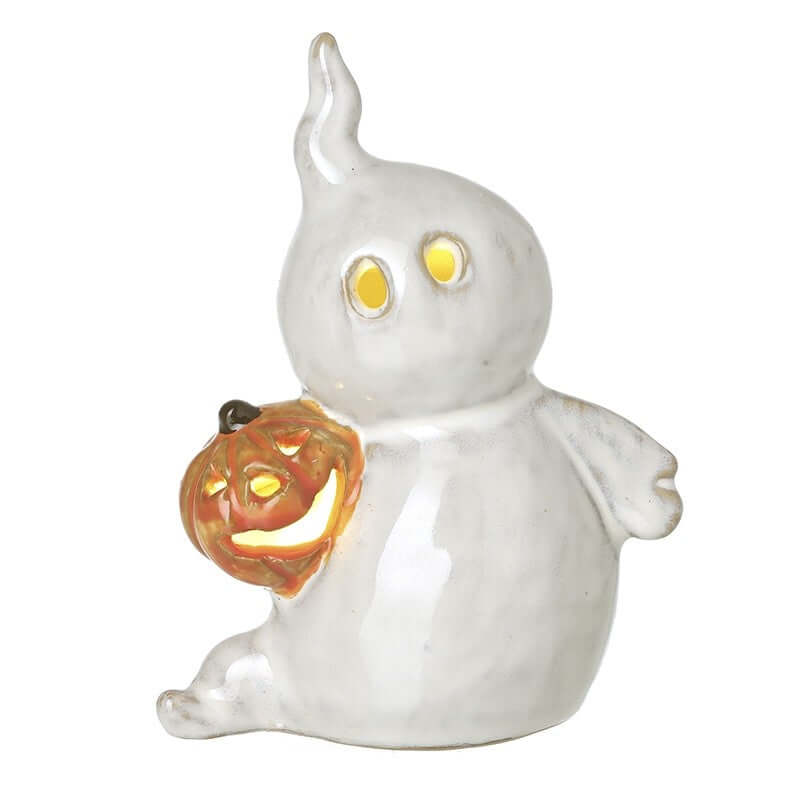 White ghost figurine holding a jack-o'-lantern on a white background