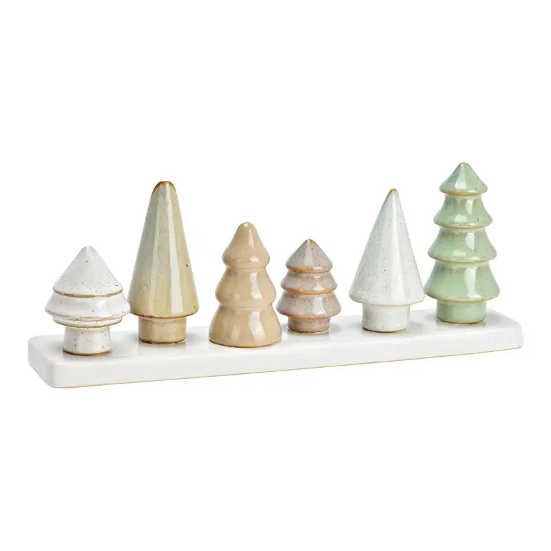 Set of ceramic Christmas trees on a white base