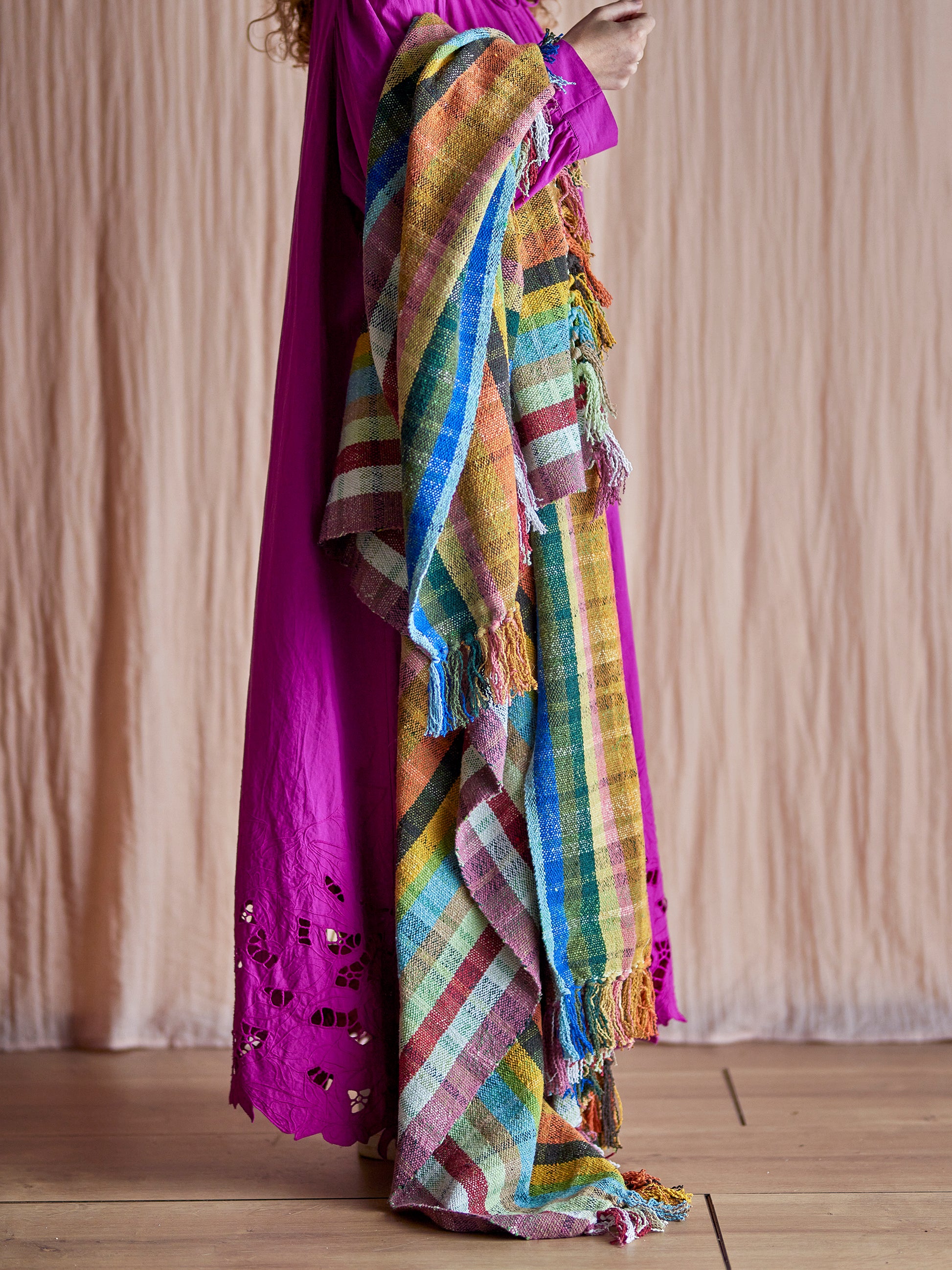 Bloomingville Elmy Recycled Cotton Throw. Colourful Checkered Blanket draped over the models arm