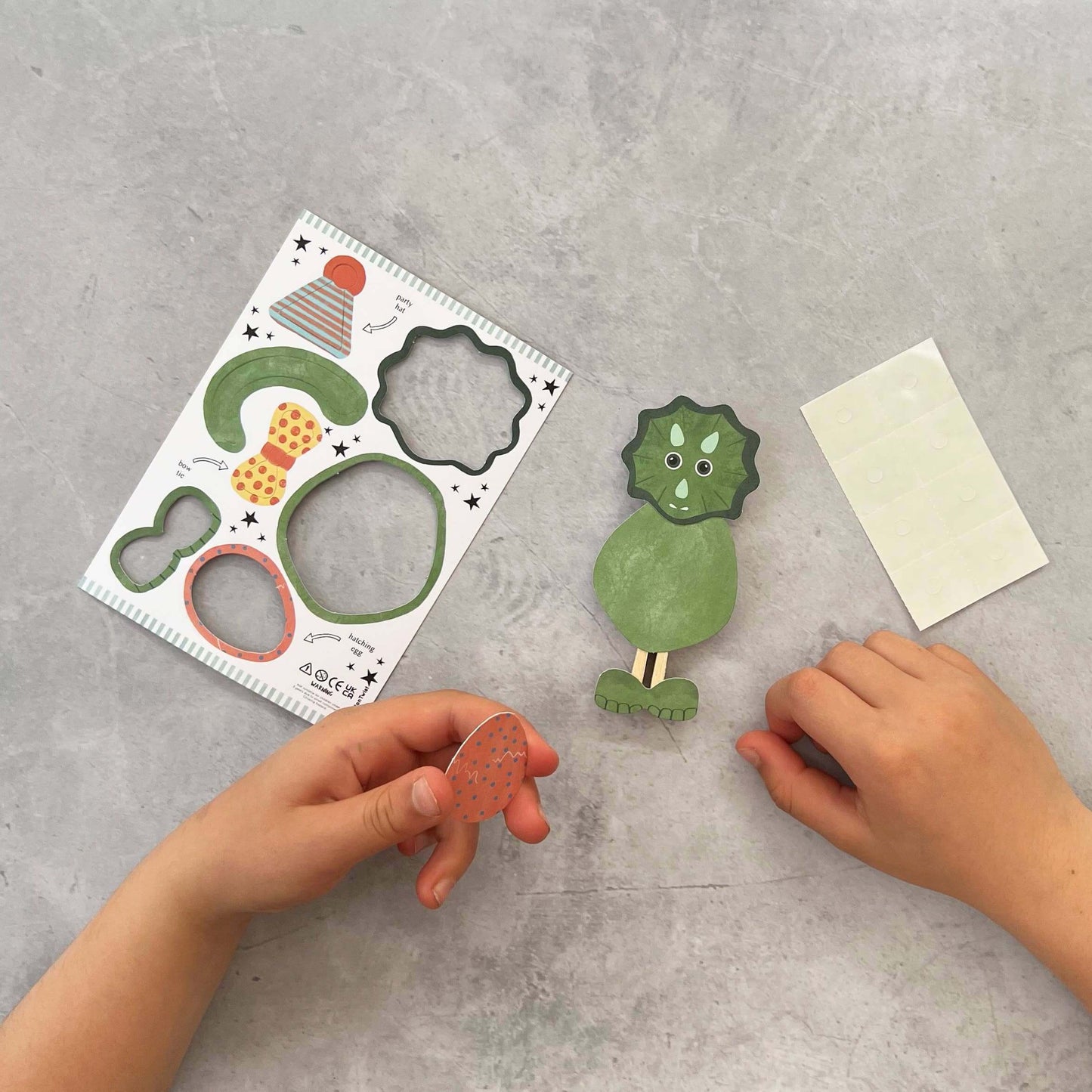 Child making a Dinosaur Peg Doll-Make Your Own