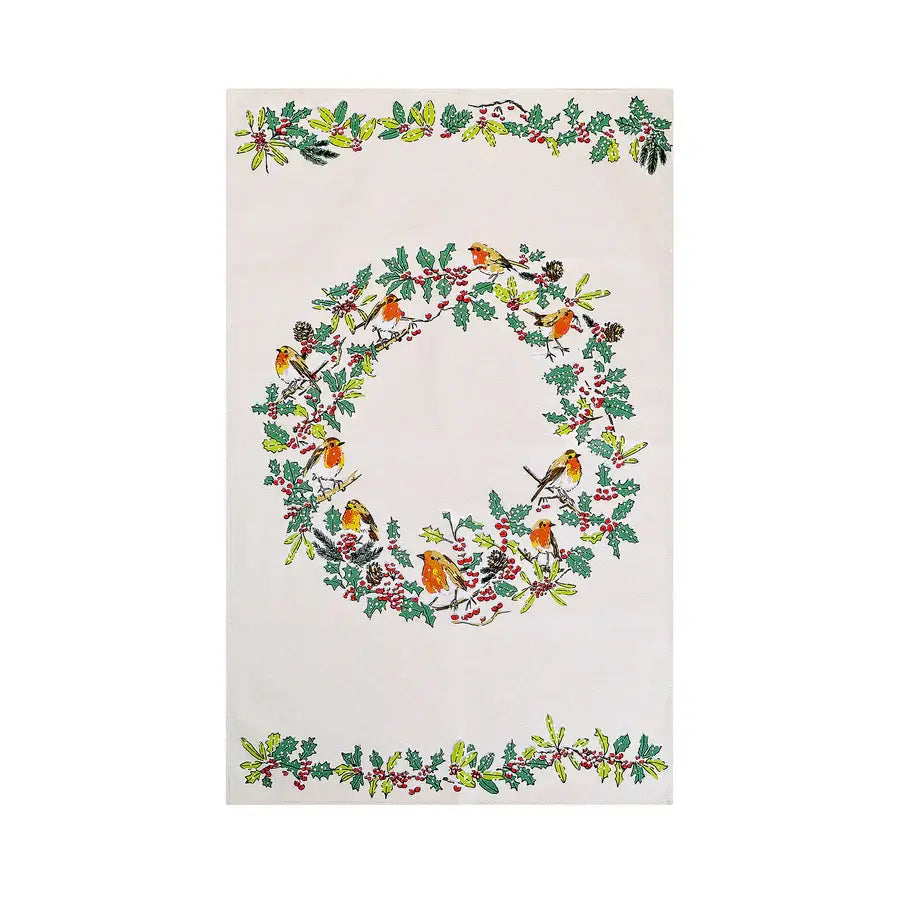 Decorative towel with a Christmas wreath design featuring birds and holly on a white background.