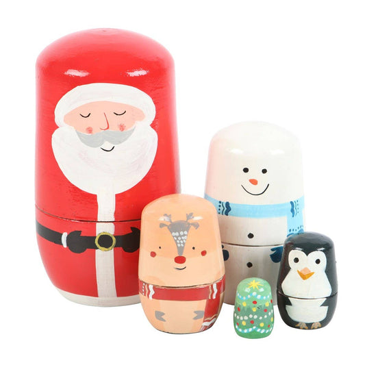 Set of nesting dolls featuring Santa Claus, a reindeer, a snowman, and a penguin on a white background.