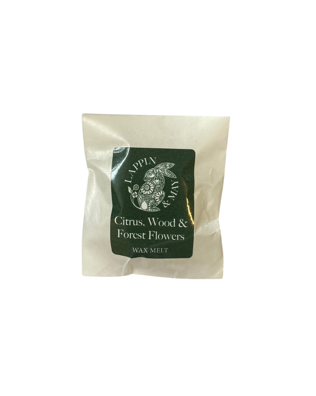 Wax melt package with a green label on a white background