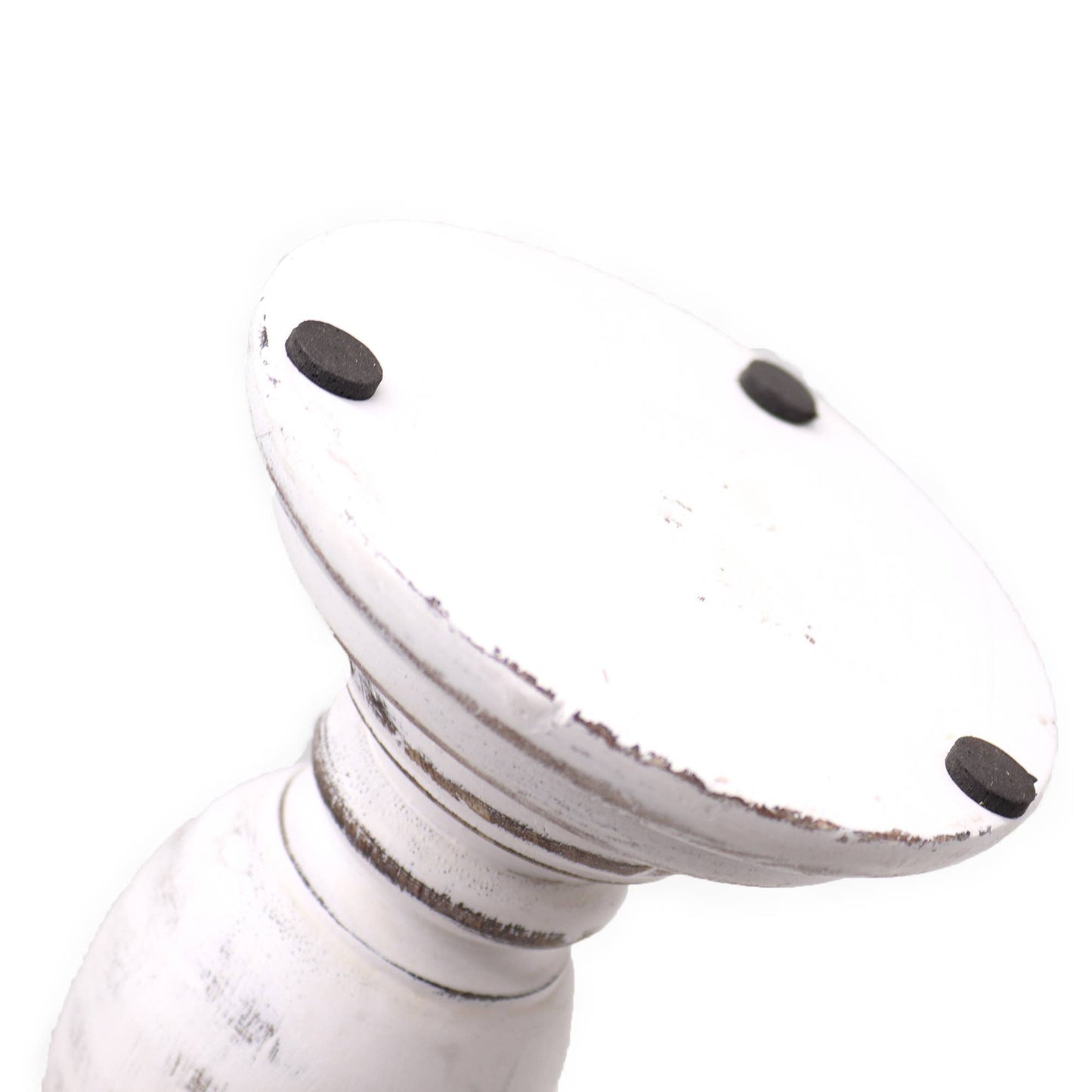 White decorative item with black accents on a white background