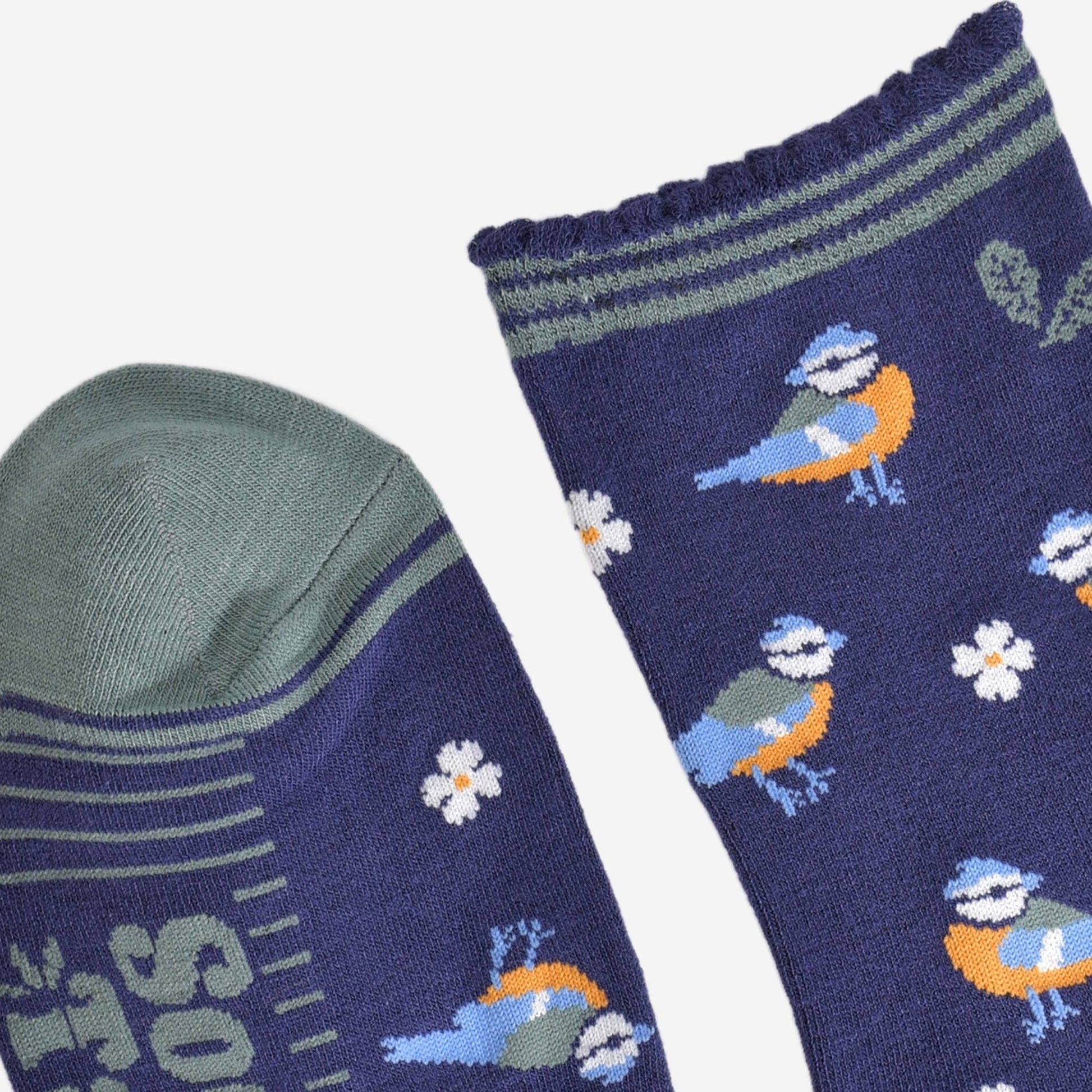Navy blue socks with bird and flower pattern on a white background
