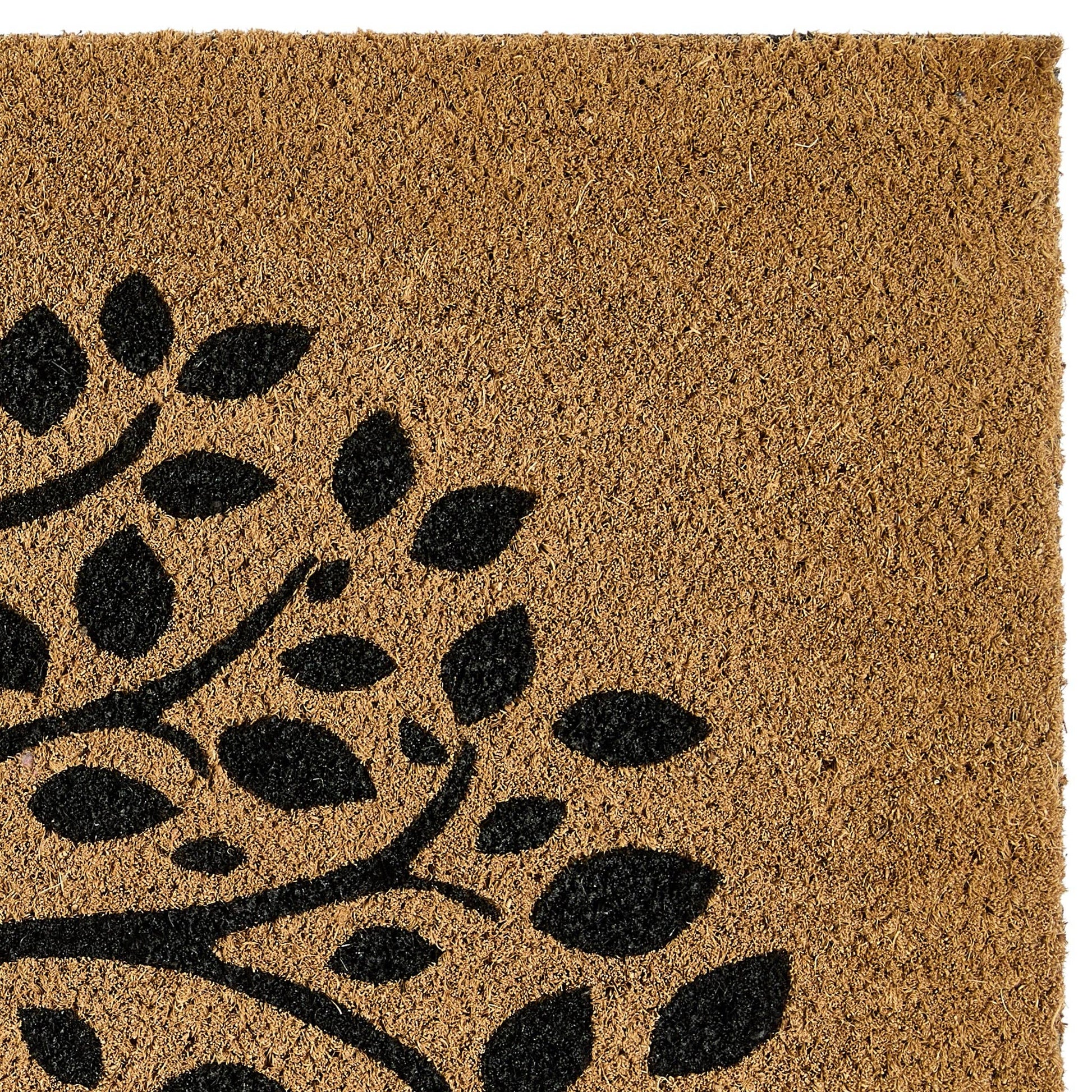 Doormat with black leaf pattern on a brown background