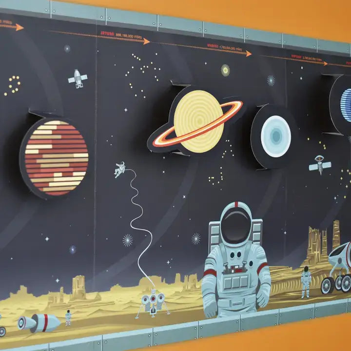 Illustration of space-themed wall art with planets, astronauts, and a robot.