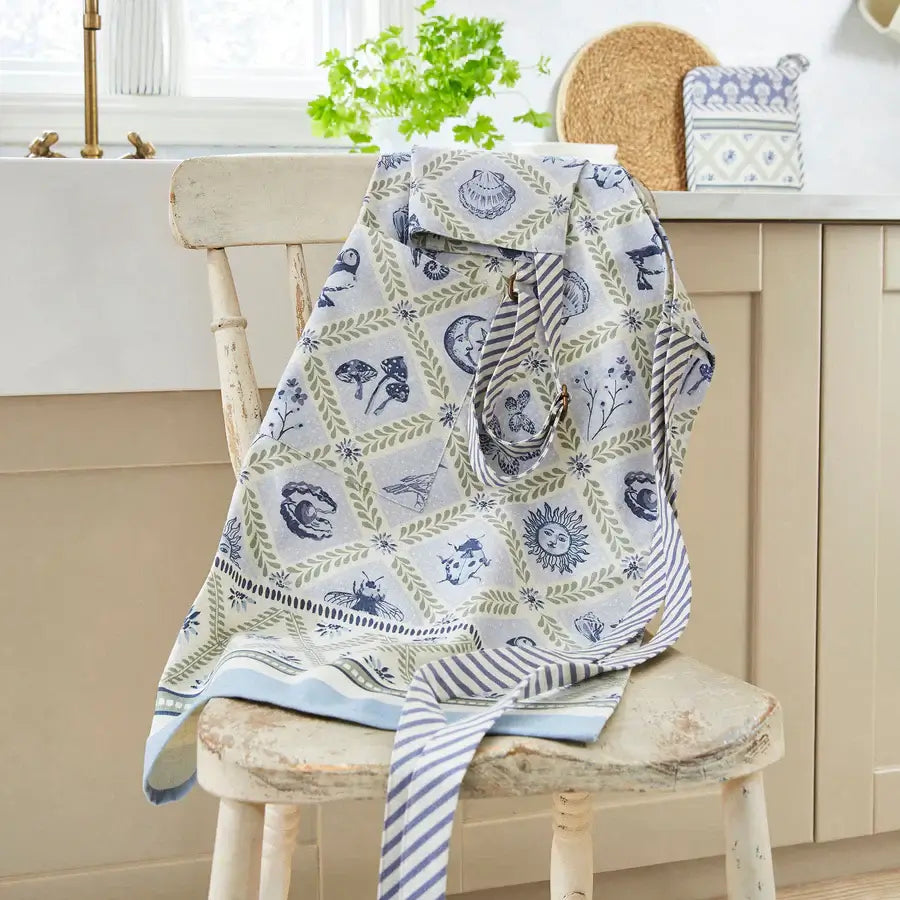 Patterned cloth draped over a wooden chair in a kitchen setting